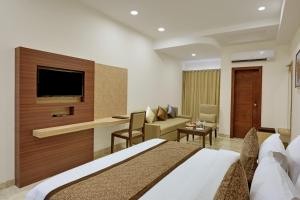 TV a/nebo společenská místnost v ubytování Hotel Cherry Wood