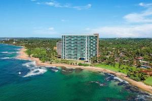 an aerial view of a building on the beach at The Turtle Galle condo in Galle