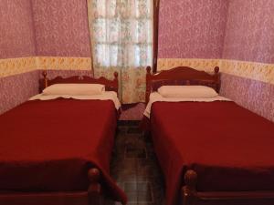 En eller flere senge i et værelse på Jardín Secreto Cachi + 3 billeder