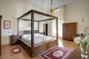Postel nebo postele na pokoji v ubytování Palazzo Ducale + 11 fotografií