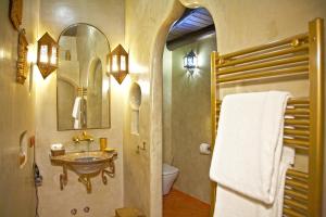 a bathroom with a sink and a toilet at Casa Pinto in Monsaraz +76 photos