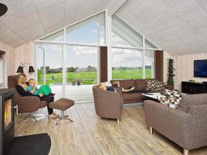 a group of people sitting in a living room at 5 star holiday home in Faaborg in Bøjden