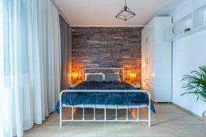 Postel nebo postele na pokoji v ubytování Omului 21 Apartment