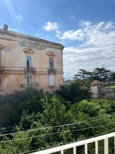 an old building on the side of a hill at Dimora San Mario in Portici
