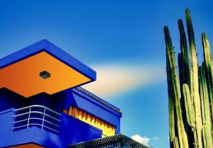 a building with a cactus next to a cactus at Jardin Yves Chic 2 bedrooms - AC - Parking in Marrakesh