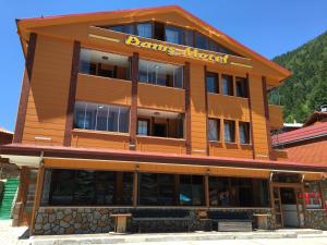 a brown building with a sign on it at Danis Motel in Uzungöl