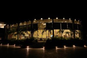 a building with lights in front of it at night at Seven Sky Clarks Exotica in Bhuj