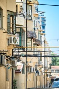 a city street with a bunch of wires and buildings at duplex 1 bedroom apartment on Wuyuan Road close Changshu Road station in Shanghai