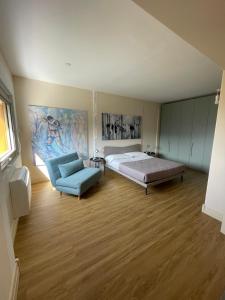 a large room with a bed and a couch at VILLA VALLE FRANCIACORTA - Appartamenti per vacanze in Rodengo Saiano +54 photos