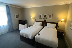 Postel nebo postele na pokoji v ubytování Winchester Cathedral View By Dancenter