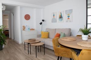 a living room with a couch and a table at Sky New in Málaga