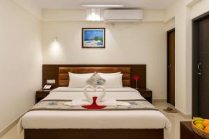 Ένα ή περισσότερα κρεβάτια σε δωμάτιο στο Ocean Palace Cox'sBazar
