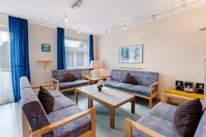 a living room with couches and a table at Ferienheim Eisenbach in Eisenbach