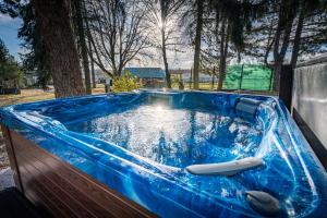 a large blue tub with a paddle in it at IPOLY VELO VENDÉGHÁZ in Slovenské Ďarmoty