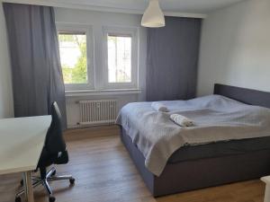 Ένα ή περισσότερα κρεβάτια σε δωμάτιο στο 3 Zimmer Apartment mit Garten