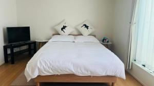 Voodi või voodid majutusasutuse 柚子屋 新築貸切戸建旅館 toas