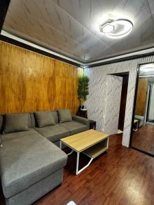 a living room with a couch and a table at Cozy Home in the heart of Mandaue City in Mandaue City