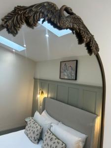 a bedroom with a bed with a dragon headboard at Spring Nook in Kelso