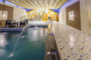 Bazén v ubytování منتجعات رسيل Raseel Cottages nebo v jeho okolí
