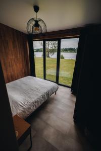 Postel nebo postele na pokoji v ubytování Laimeskalni