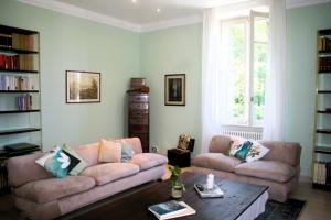 a living room with two couches and a coffee table at Villa Marina Como Boutique B&B & Apartments in Como