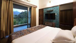 Postel nebo postele na pokoji v ubytování ByTheLakeResort