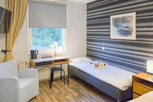 Ένα ή περισσότερα κρεβάτια σε δωμάτιο στο Hotel Ukkis & Safaris