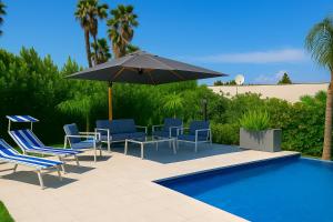 Πισίνα στο ή κοντά στο Resort Villa Brucoli Gardens of Syracuse