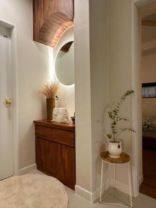 a bathroom with a sink and a mirror and a table at Dal Dam, a pet-friendly accommodation in the west of Jeju, a private underground bunker event room for family groups in Ŭmbu-dong +76 photos