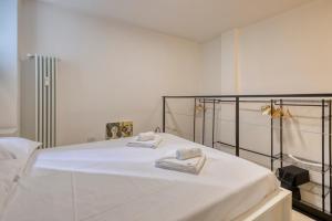 Ένα ή περισσότερα κρεβάτια σε δωμάτιο στο I-Host Apartment - Maffei 20