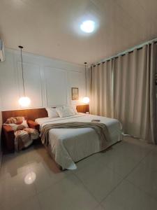 Katil atau katil-katil dalam bilik di Beautiful confortable house for COP 30