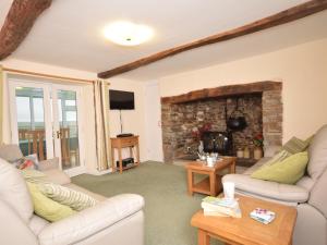a living room with two couches and a fireplace at 3 Bed in Hartland GLAKE in Hartland