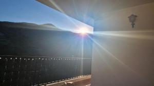 a view of the sun shining from a balcony at The Retreat, Alcazar in Órgiva