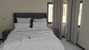 Postel nebo postele na pokoji v ubytování Kalulushi Executive Lodge Limited
