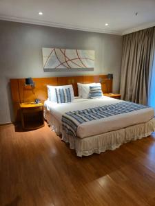 Ένα ή περισσότερα κρεβάτια σε δωμάτιο στο Studio Barra Marapendi