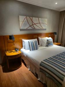 Ένα ή περισσότερα κρεβάτια σε δωμάτιο στο Studio Barra Marapendi +21 φωτογραφίες