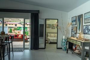 a living room with a couch and a table at JJ Lux Residential in Jacó