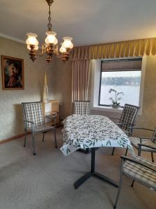 a dining room with a table and chairs and a window at Apartment in beautiful Southern Palatinate! in Bellheim