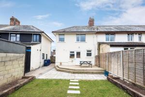 a backyard of a house with a fence at Family Home W Patio & Serene Backyard in Oxford