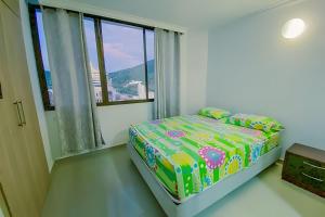 Postel nebo postele na pokoji v ubytování Oasis Marino - Apartamento de 2 Alcobas en El Rodadero