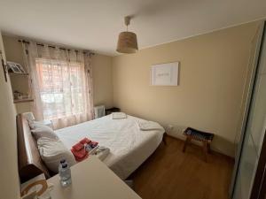 a hospital room with a bed and a window at Porto Nest in Senhora da Hora