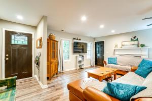 a living room with a couch and a table at Otter Creek Rec Area On-Site! Serene Family Home in Muldraugh