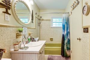 a bathroom with a sink and a mirror at Otter Creek Rec Area On-Site! Serene Family Home in Muldraugh +20 photos