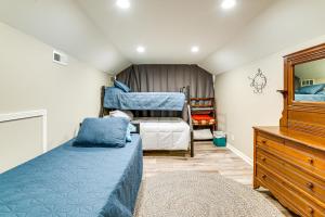 a bedroom with a bed and two bunk beds at Otter Creek Rec Area On-Site! Serene Family Home in Muldraugh