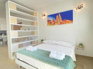 a bedroom with two beds and shelves at Suite Emilia 7 in Bologna