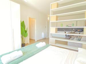 a bedroom with a bed and a sink in it at Suite Emilia 7 in Bologna +6 photos