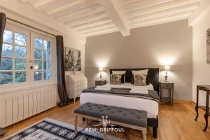 a bedroom with a bed and a large window at La Maison de la Corniche Enjoy an Authentic Stay in Normandy - 8 Pax in Barneville-la-Bertran