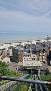 a view of a city with buildings and the ocean at Villa Mona Studio Galets quartier des Cordiers in Le Tréport