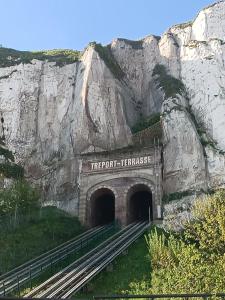 a tunnel on the side of a mountain at Villa Mona Studio Galets quartier des Cordiers in Le Tréport +2 photos