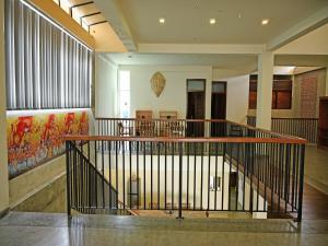 a lobby with a staircase in a building at Villa Opera House in Galle